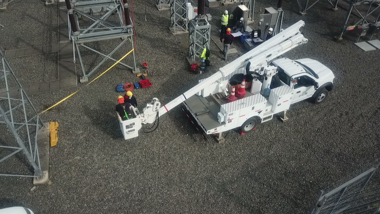 Aerial lift truck and crew on an electrical site